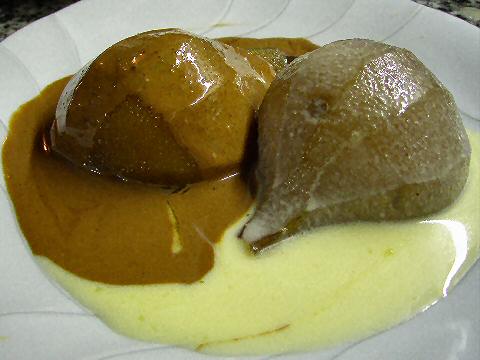 Warm poached pears with two chocolate sauces