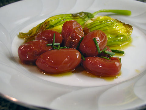 Ricotta stuffed zucchini blossoms with burst cherry tomato sauce