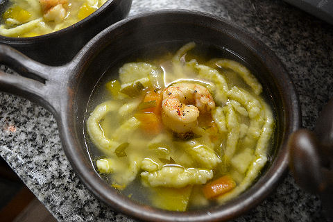 Roasted Vegetable Broth with Mustard Spaetzle and Horseradish Prawn