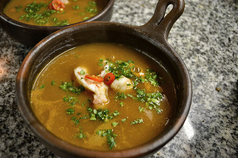 Tomato and Herb Broth with Poached Prawns