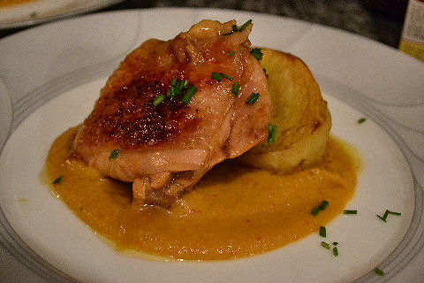 Glazed chicken with fondant potato and carrot hummus