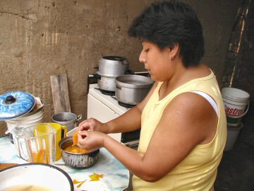 Maria making aji de gallina