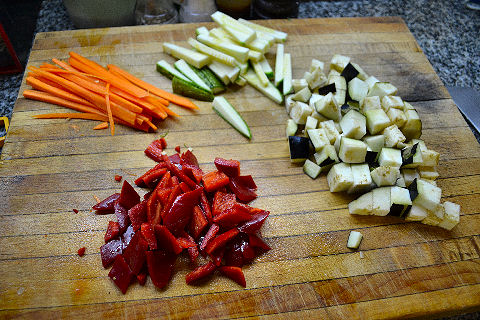 Boga en pieles de panceta, risotto de papa y vegetales