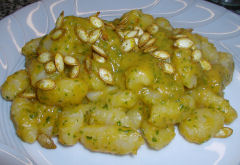 Potato gnocchi with squash and arugula sauce