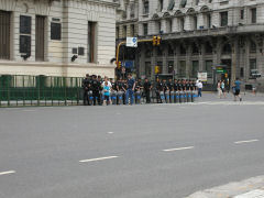 Federal police guard government buildings and keep a few protestors away