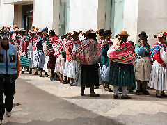 Aymara women lined up at the bank