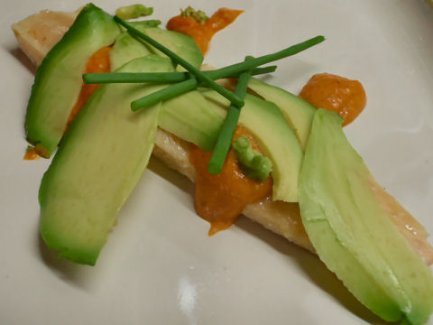 Olive oil poached trout with shaved avocado and romesco sauce