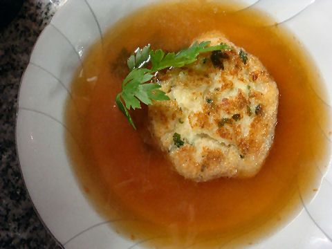 Seafood consomme with potato-fish fritter