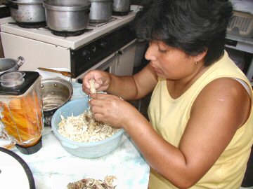 Maria making aji de gallina