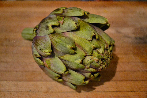 Artichoke on cutting board