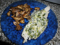 Cod with green onion sauce and sauteed mushrooms