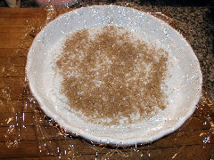 Gravlax - line a pan with plastic wrap, salt and sugar