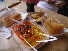 Locro, empanadas, and a tamale from a street stand