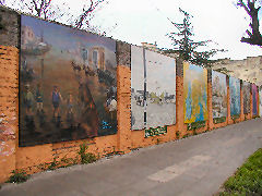 Historic murals line the Sur Paredon