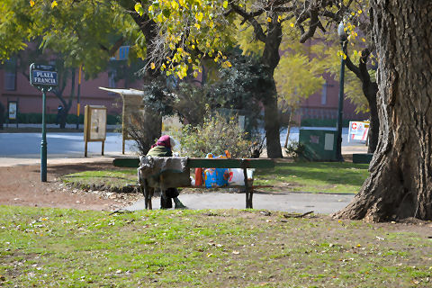 Homeless woman on Plaza Francia